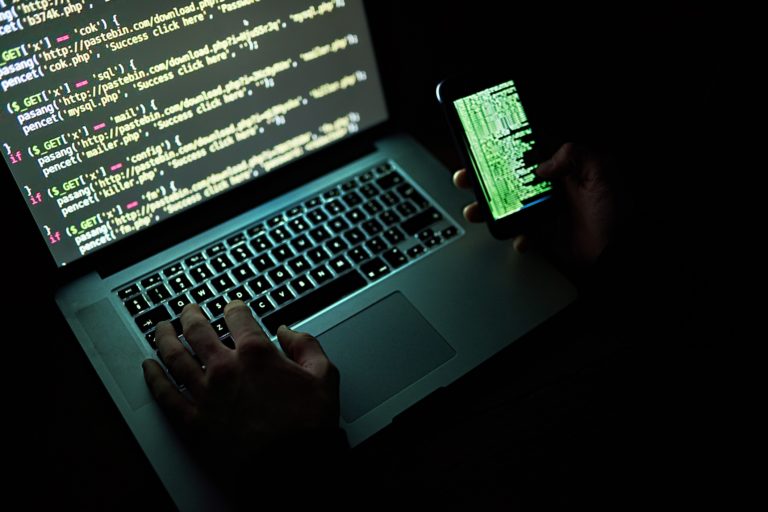 Hacker using laptop