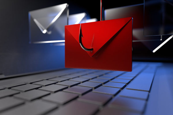 a red envelope is suspended on a fish hook over a sleek computer keyboard.