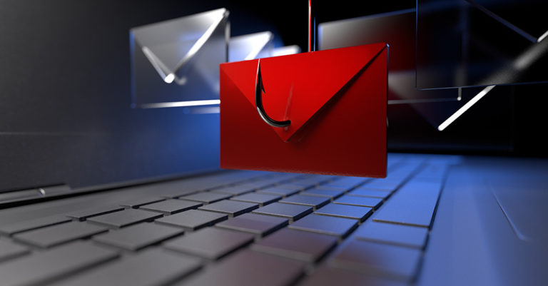 a red envelope is suspended on a fish hook over a sleek computer keyboard.