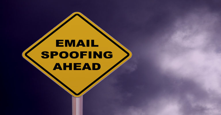 a warning sign in yellow with email spoofing written on it in black.