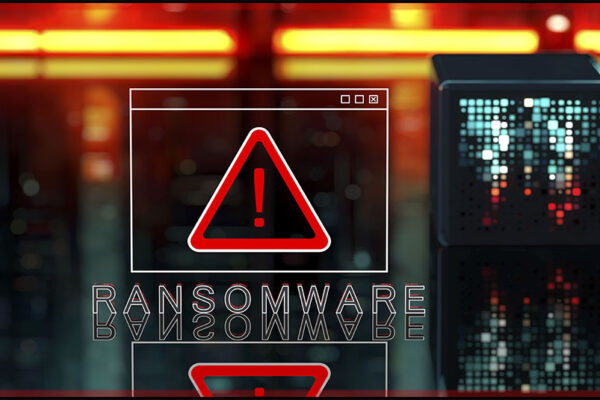 a small digital screen shows a triangular caution sign wheile the word ransomware appears below it in grey on a background of yellow and red digital screens